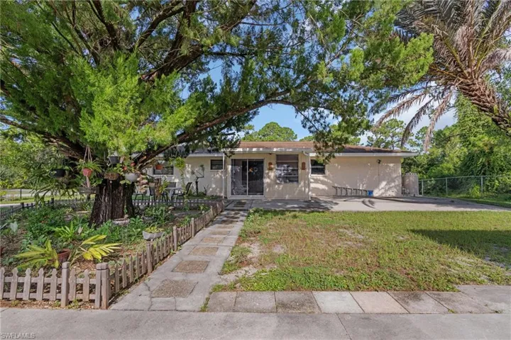 View of front of property featuring a front lawn