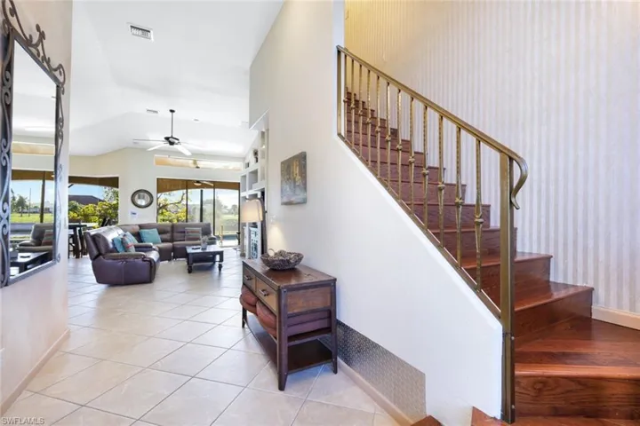 The stairway to the upper level and the Master Suite