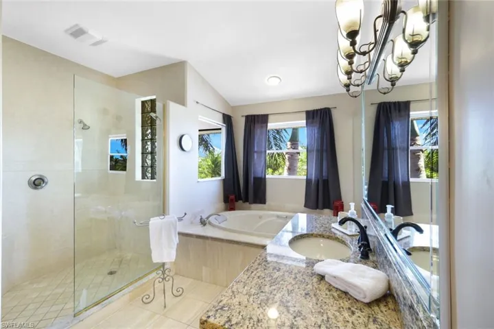 The Master Bath has a jetted bath tub, separate shower + twin basins