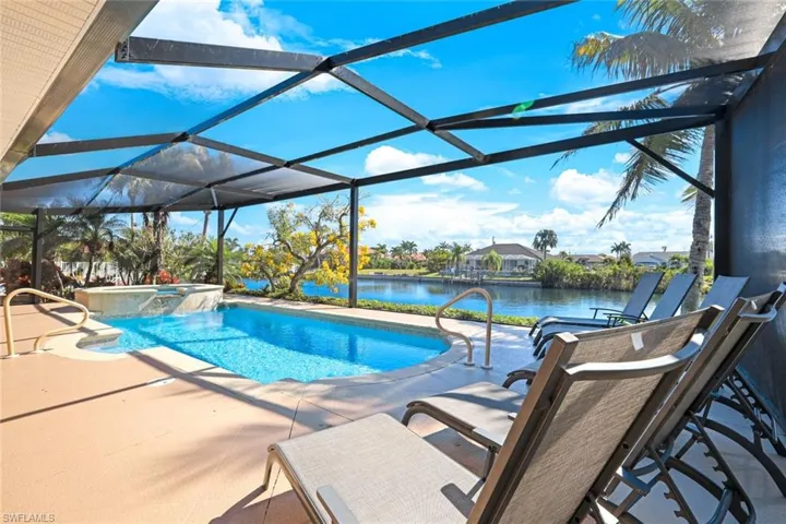 The large pool deck with new cage with picture screens