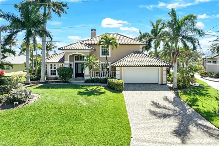 Front of house with block paved drive