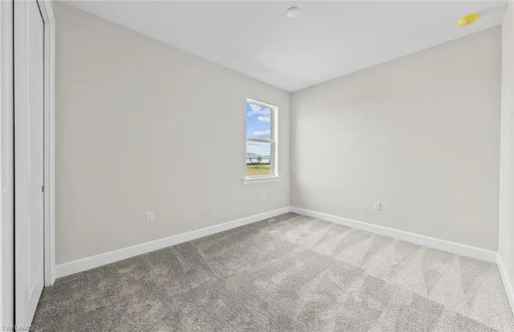 Unfurnished bedroom featuring carpet floors