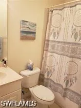 Bathroom featuring vanity and a shower with shower curtain