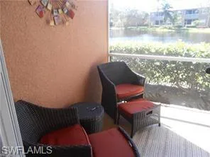 Sunroom featuring a water view and a tanning bed
