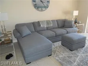 Living area featuring light tile patterned floors