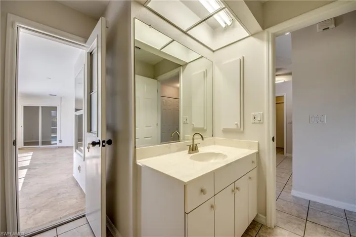 Bathroom featuring vanity and light tile patterned floors