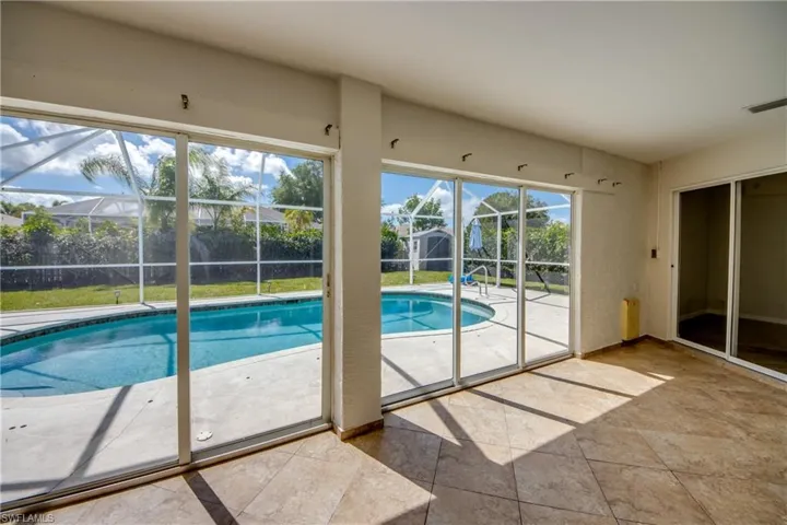 Outdoor pool with a sunroom