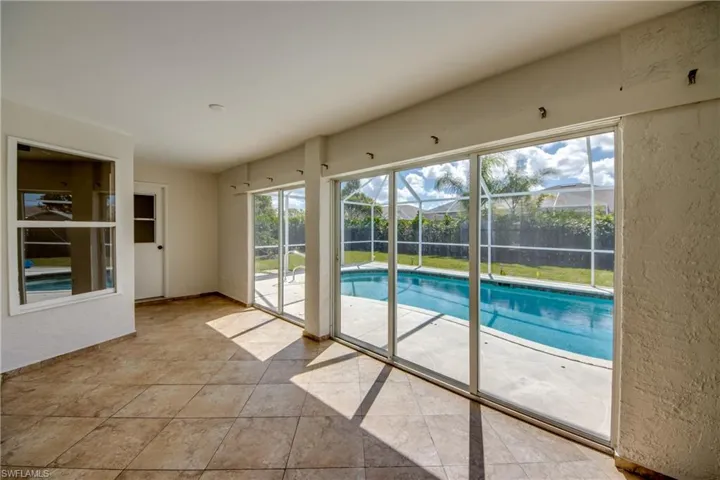 View of pool with a sunroom