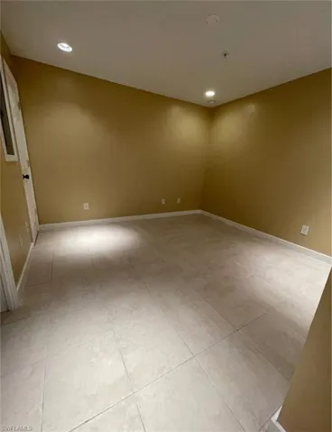 Unfurnished room featuring recessed lighting and light tile patterned floors