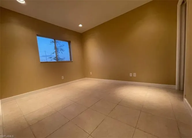 Unfurnished room featuring recessed lighting and light tile patterned floors