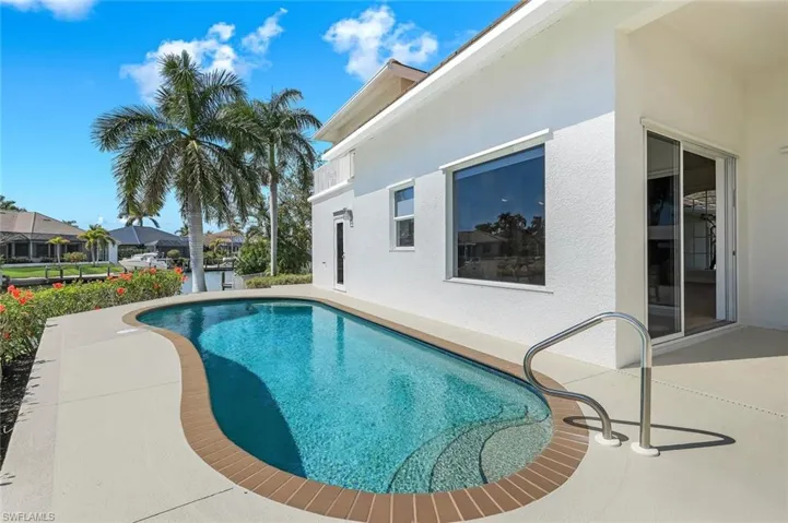 Outdoor pool featuring a patio area