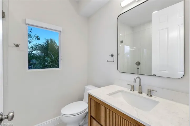Full bathroom with vanity and a walk in shower for the upstairs rooms to share