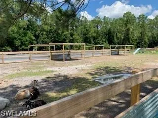 View of yard featuring fence