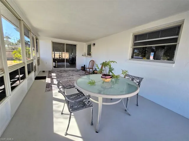 Covered Lanai facing Sliders to Family Room - View 3