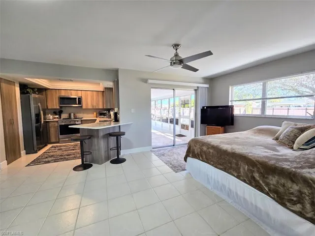 Family Room facing Kitchen & Sliders to Lanai