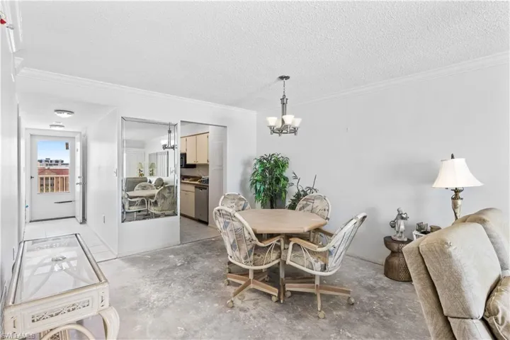 The living room is open and airy, perfect for entertaining or relaxing after a day at the beach.