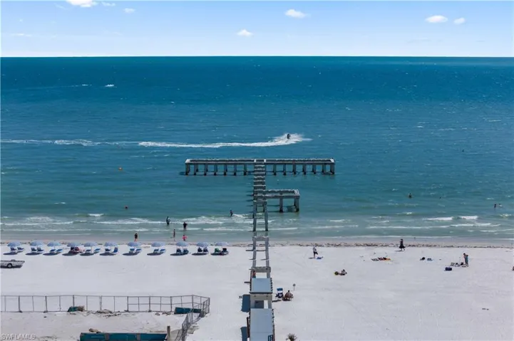 Fort Myers Beach Pier is a beloved landmark extending gracefully into the sparkling Gulf waters.
