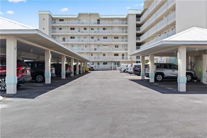 The property includes a convenient covered carport, providing easy and secure parking close to the building entrance.