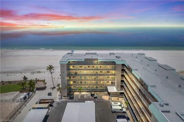 Your beachfront escape—2BR condo with sunset balcony and pool access.