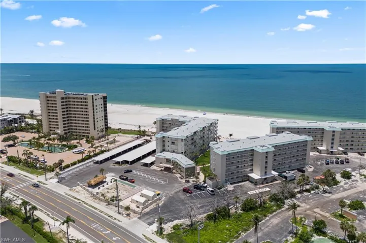 Leonardo Arms from above: steps from the shore, surrounded by turquoise water. A perfect slice of paradise on Fort Myers Beach.