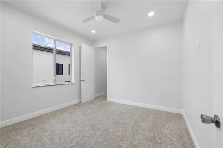 Unfurnished bedroom featuring carpet flooring, ceiling fan, and recessed lighting