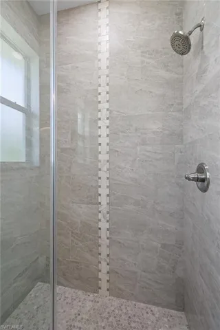 Bathroom with a tile shower