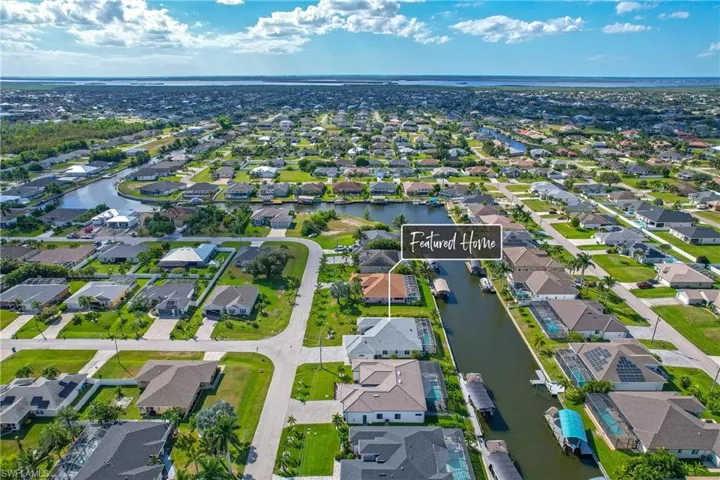 View of property location with nearby suburban area and a nearby body of water