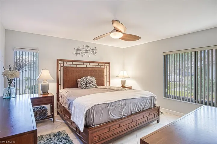 Master Bedroom with King Size Bed featuring ceiling fan and light tile patterned flooring