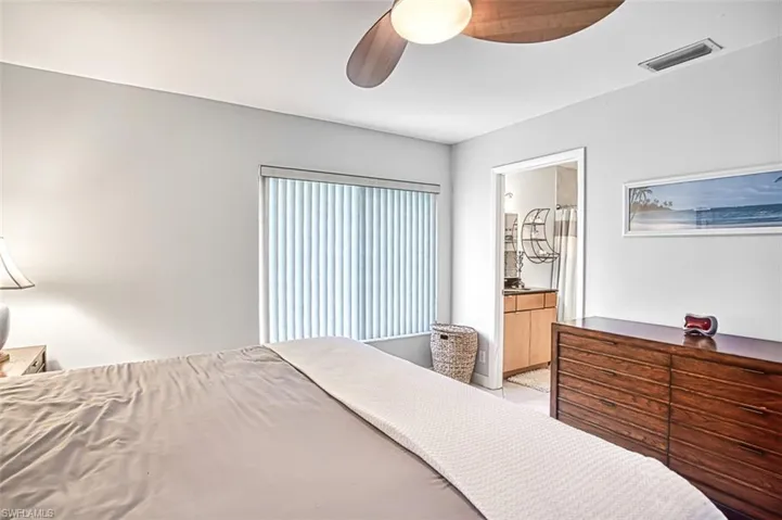 Master Bedroom with connected bathroom and ceiling fan