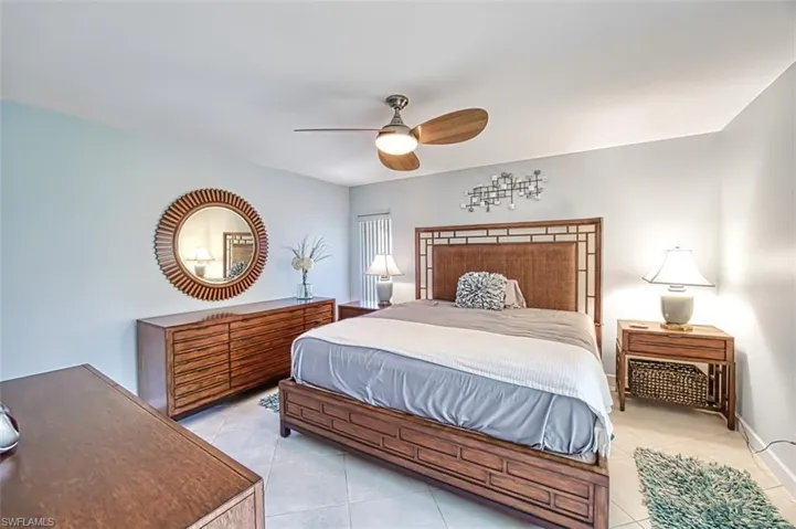Master Bedroom with ceiling fan and light tile patterned floors