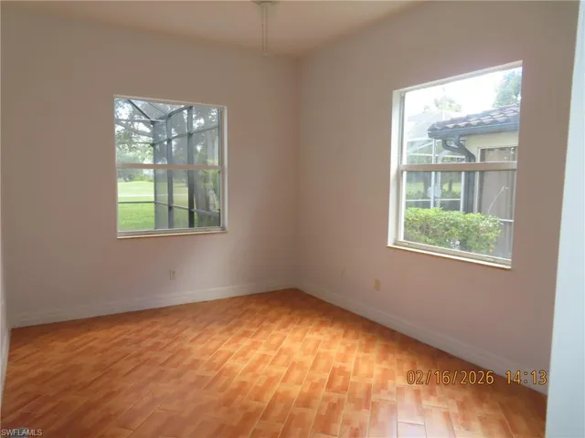 Empty room featuring healthy amount of natural light and light wood-type flooring