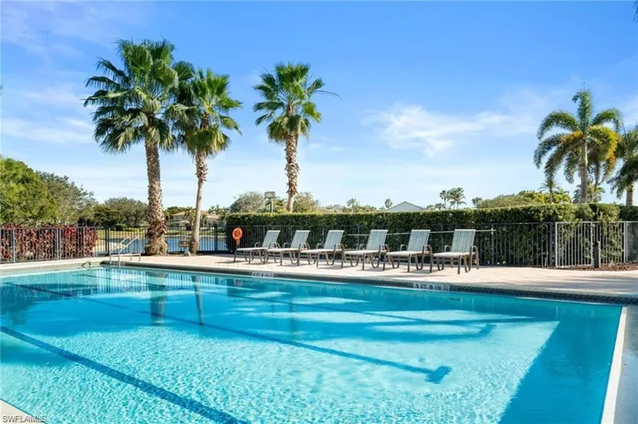 Community pool featuring a patio