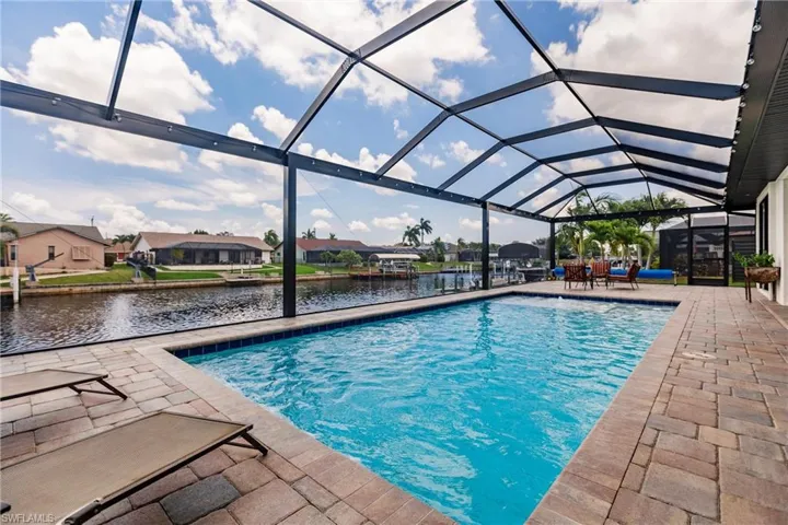 View of pool featuring a lanai and a patio area