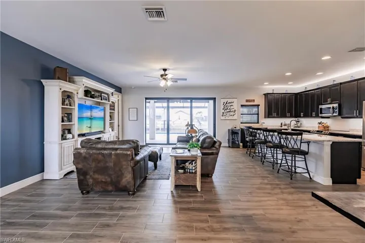 Living room with sink and ceiling fan