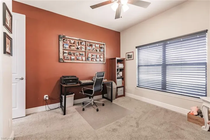 Guest bedroom/Office space featuring carpet and ceiling fan