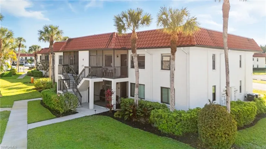 FRONT ELEVATION- NICELY LANDSCAPED WITH FLORIDA VEGETATION