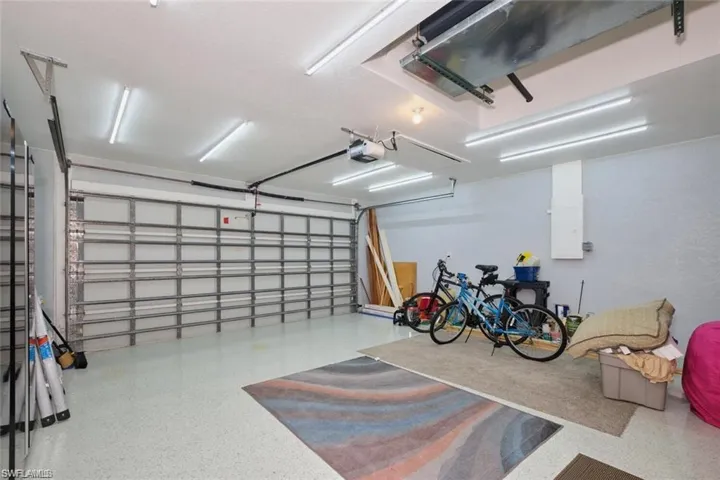 Garage featuring a garage door opener