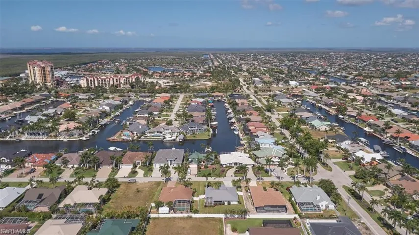 Drone / aerial view featuring a water view and a residential view
