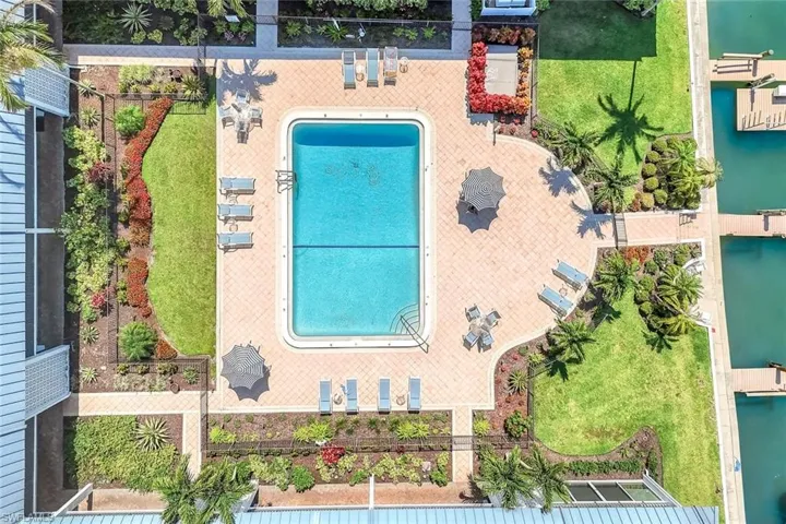 View of subject property featuring a pool area