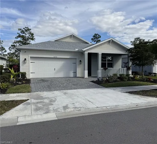 Single story home with garage and covered porch.