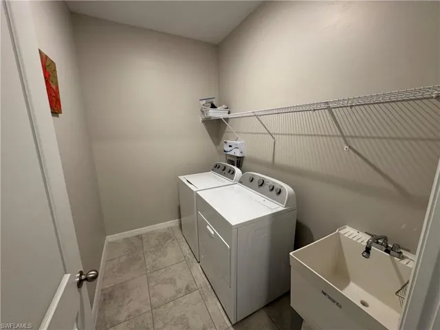 Laundry area with sink and ozone system.