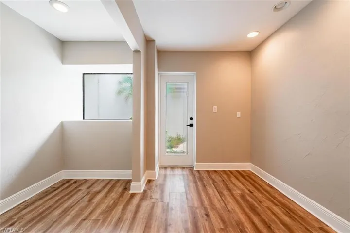 Entrance foyer with light hardwood / wood-style flooring