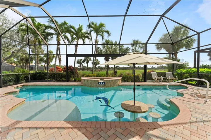 Custom-designed pool with a luxurious jacuzzi for the ultimate relaxation and outdoor enjoyment.