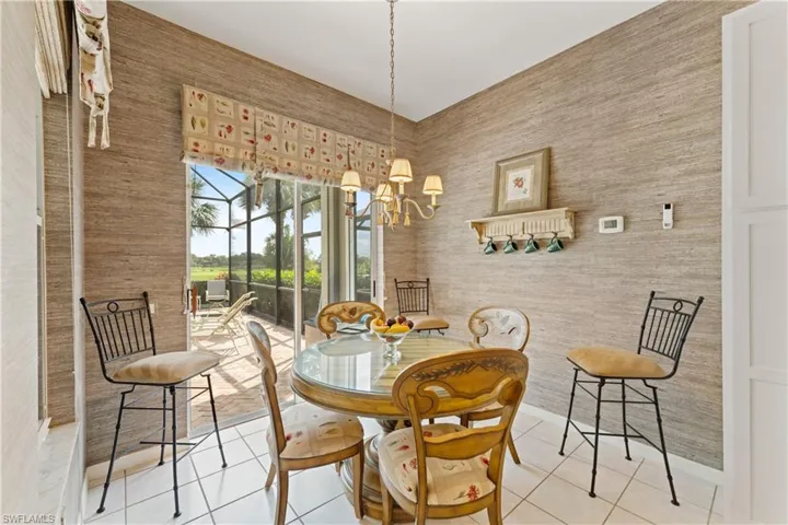 Charming breakfast nook with picturesque views of the pool and golf course, perfect for enjoying your morning coffee.