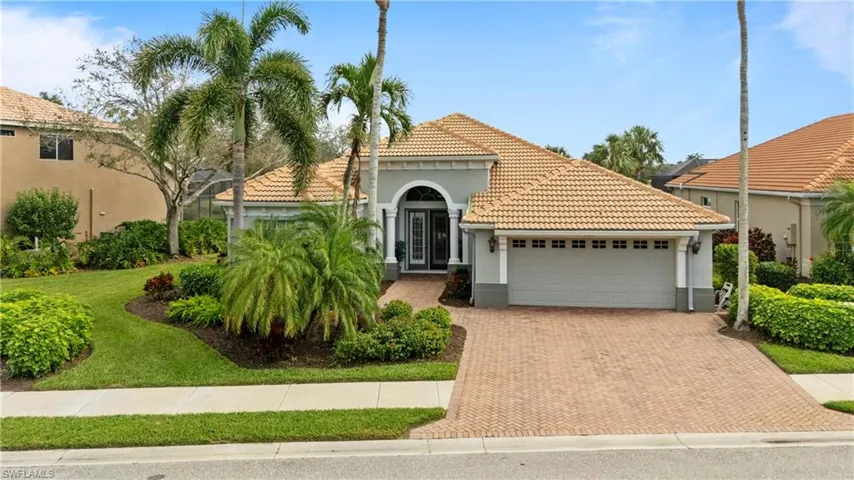 This stunning residence is perfectly situated on the 9th tee, offering breathtaking golf course views. Featuring a new tile roof and an extended driveway.