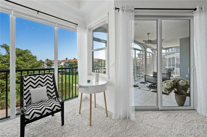 Sunroom / solarium featuring carpet and plenty of natural light