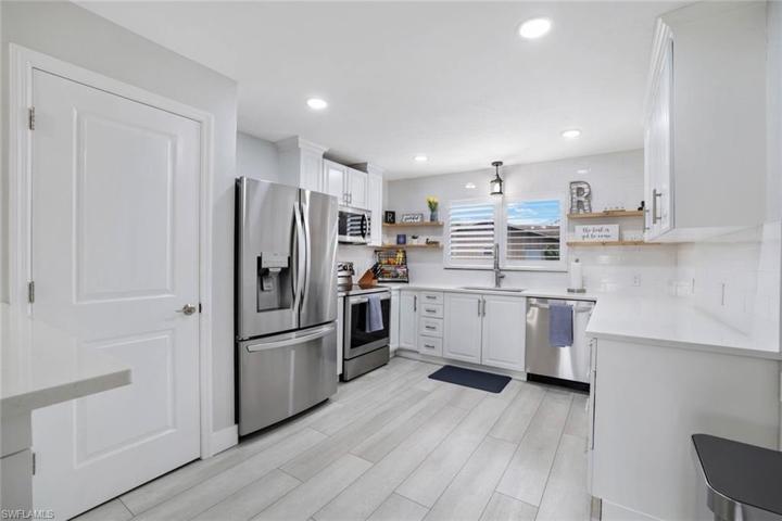 Renovated kitchen, new countertops, appliances, lighting and a large pantry