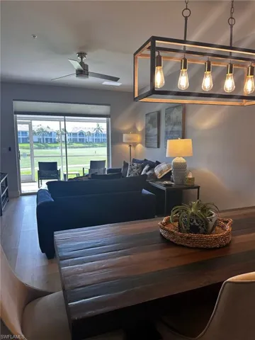 Living room with ceiling fan and wood finished floors