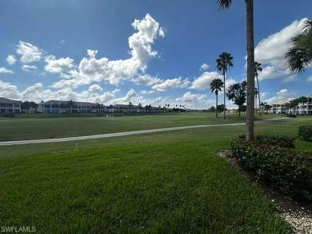 View of community featuring a yard