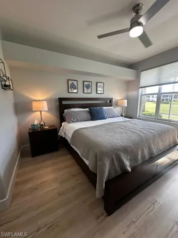 Bedroom featuring wood finished floors and a ceiling fan